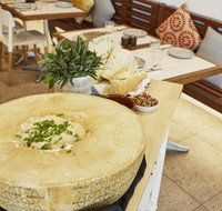 Flaming Cheese Wheel and Wine Experience Broadway - Kawana Tourism
