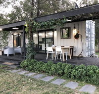 Absolute riverfront shipping container cabin - Kawana Tourism